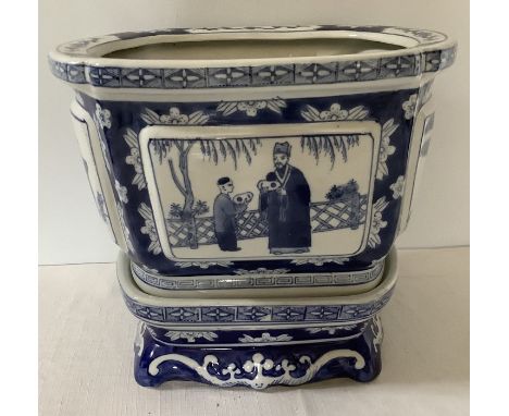 A Chinese 20thC blue and white planter + stand. 26 x 22 x 23cms. 