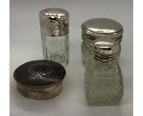 Three silver topped jars with a silver and tortoiseshell piqué box. 6cms d.  