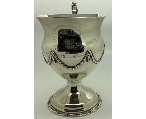 A good quality silver mug inscribed to front, London 1912, T.W Long + Co Cardiff inscribed to base, 12cms h. 218.4gms. Condit