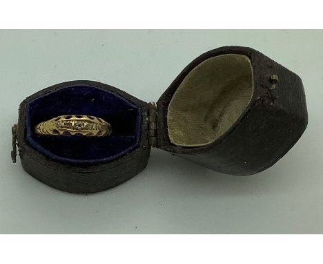 An unmarked 19thC yellow metal ring set with 5 diamonds in contemporary ring box.  Size K, 1.4gms. 