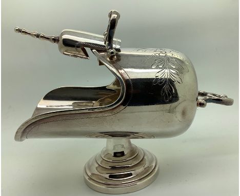 A helmet shaped sugar bowl and scoop marked .925 sterling silver. 14cms l. 186.8gms. Condition ReportSight dint to rear near 