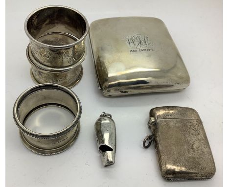 Silver to include cigarette case, vesta case, whistle London 1881 and 3 napkin rings. 199.2gms. 
