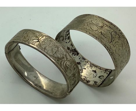 Two vintage bangles, one marked sterling, the other hallmarked silver Chester 1956, 57.2gms.