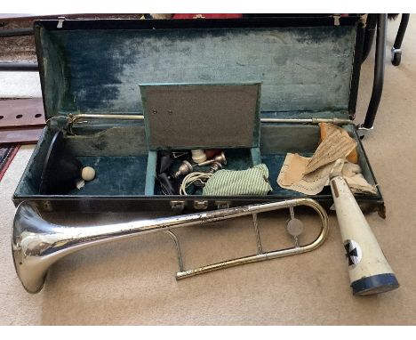 A Brass and silver plated trombone in a fitted case with 4 mutes - mouthpieces etc, maker, King 3B Concert Silver Sonic. The 
