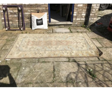 A vintage Turkish hand knotted rug, no obvious damage apart from faded. 204 x 118cms. 