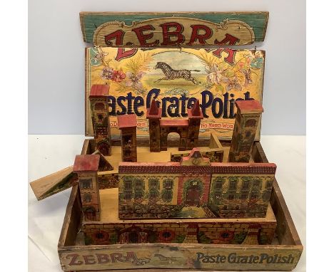 An early 20thC Zebra Paste Grate Polish advertising/display box containing vintage toy fort and a quantity of vintage toy for