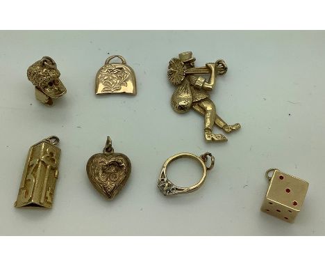 Seven various 9ct gold charms including chimney sweep, dice ring, heart, bell and bird. 16.2gms total. 