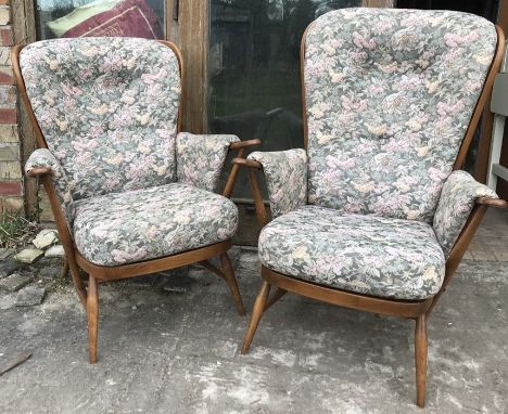 Pair of Ercol Windsor stick back armchairs with floral upholstered cushioned seating.The chairs and cushions are in good cond