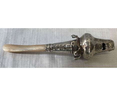A silver and mother of pearl child's whistle/rattle, lacking bells, Cocks and Bettridge, Birmingham 1812. 13.5cms l. 