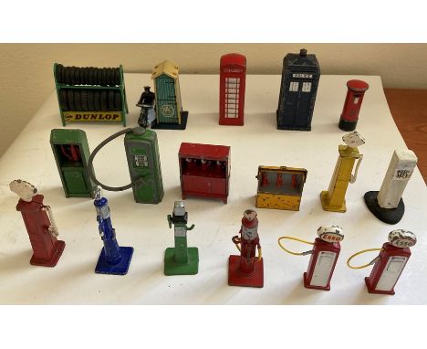 A large collection of Dinky toys playworn toys to include Dunlop tyre rack, Telephone box, Police box, Petrol pumps etc. 