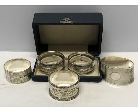 Boxed pair of Chester silver napkin rings together with 3 others, all Chester. 105gms approx. 