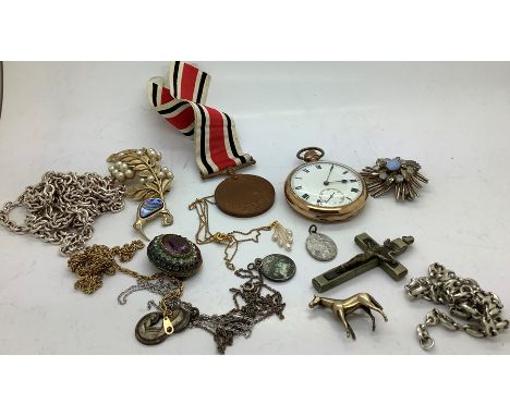 A quantity of vintage costume jewellery to include pocket watch, horse brooch, marked silver, special constabulary medal, bro