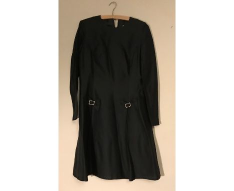 A vintage little black dress with diamante box detail to front label for Montigo Bay. 