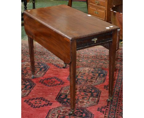 An Edwardian mahogany Pembroke table, canted dropleaves, single drawer to frieze, blind drawer to verso, tapering square supp