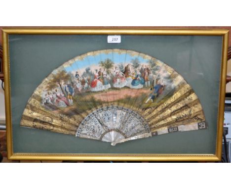 An early 19th century French forty-three stick fan, printed and then overpainted in colourful tones of gouache with a musical