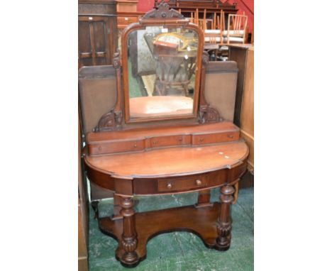 A Victorian Duchess dressing table, architectural pediment, carved uprights, three drawers to superstructure, demi-lune top, 