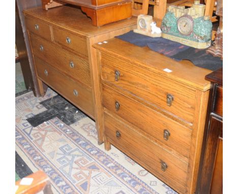 A light oak chest of three drawers; an oak dressing table base, two short drawers over two long. (2)