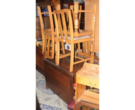 A 1950's oak dropleaf table; four light oak dining chairs. (5)