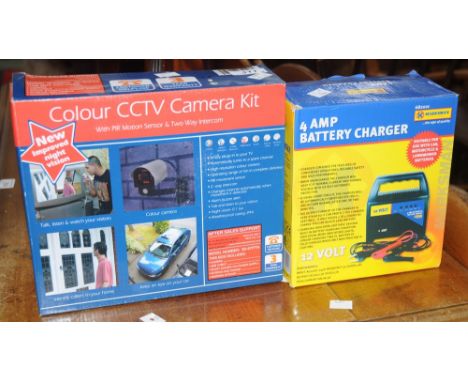 A colour CCTV camera kit, boxed; a four amp battery charger (2)