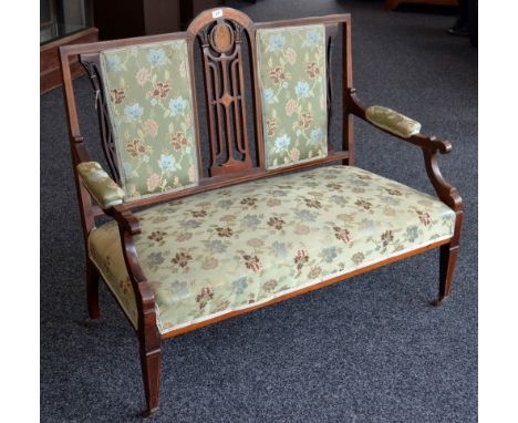 An Edwardian inlaid salon settee, pierced and padded back, stuffed overseat, tapering square forelegs, ceramic casters.