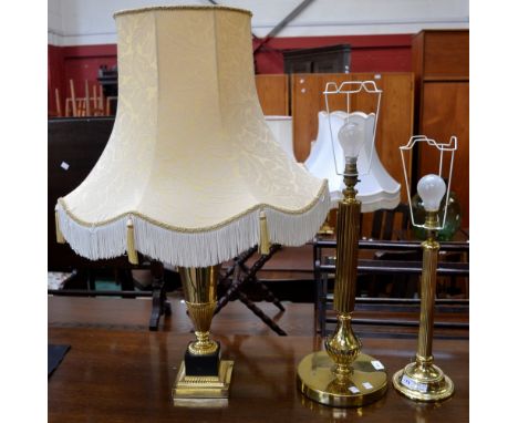 Lighting - a large brass columnar table lamp; another, smaller; a brass urn shaped table lamp (3)