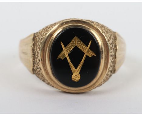 A 9ct gold masonic ring, with carved Masonic symbol set in cabochon, 4.3g