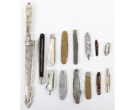 A selection of early folding knives, including Inux sheathed knife decorated with Sphinx and swan, with four Victorian mother