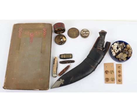 A mixed lot including A Kukri in scabbard, a selection of brass and gilt military buttons, three antler horn combination kniv