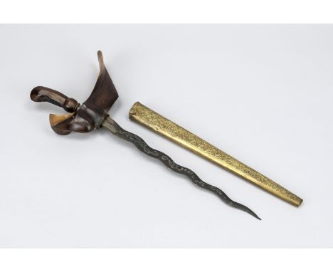 Kris, Indonesien, 19./20. Jh., ornamental beschnitzter Griff aus dunklem Hartholz, Holzscheide mit ornamental verzierter Mess