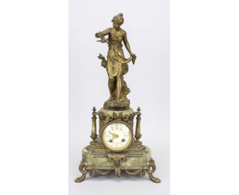 Bronze Figurenpendule, bez. ''Paisonniere par Ferrand'' im Schild, in der Bronze signiert ''Ferrand'', dargestellt Frau mit V