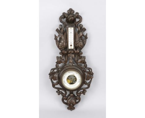Jagdliches Barometer für die Wand, Ende 19. Jh., dunkles Holz beschnitzt und durchbrochen gearbeitet, leicht ber., H. 65 cm