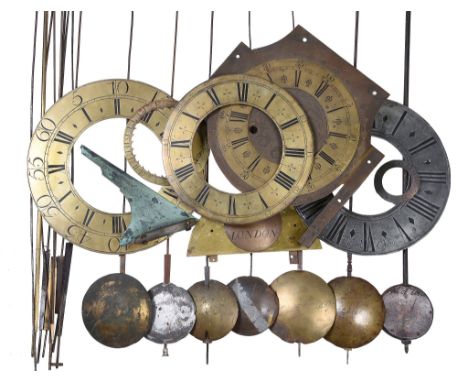  A quantity of clock dial fittings and longcase clock pendulum parts Various makers, late 17th century and later  To include 