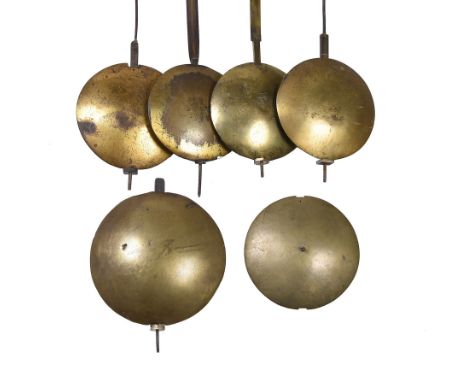  Four longcase clock pendulums Anonymous, late 18th century  Each with lenticular bob three brass faced on both sides, the fo