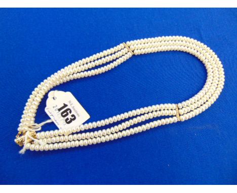 A fresh water Pearl three strand necklace with 14ct Gold clasp and spacers