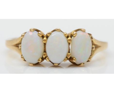 A vintage gold three stone opal ring, tests as 9ct gold, M, 2.1gm 