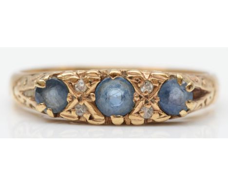 An Edwardian style vintage 9ct gold three stone sapphire ring, diamond points between, M, 2gm 