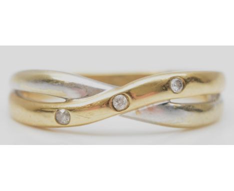 A 9ct gold and three brilliant cut diamond twist ring, O 1/2, 2.4gm 