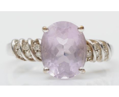 A 9ct white gold amethyst and diamond dress ring, M, 3gm 