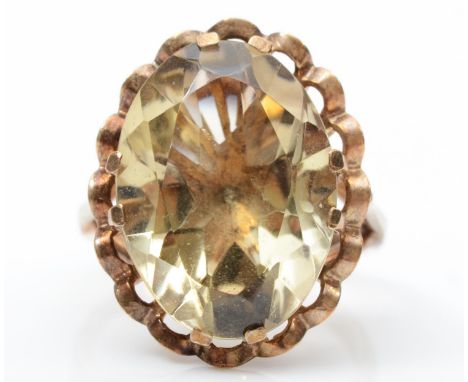 A 9ct gold and smokey quartz dress ring, stone 18 x 13mm, L, 5.7gm 