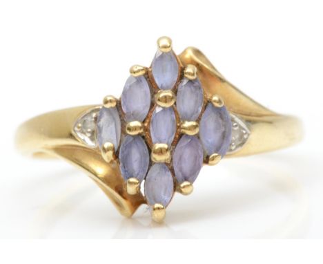 A 9ct gold tanzanite cluster ring, diamond set shoulders, S, 3.1gm 