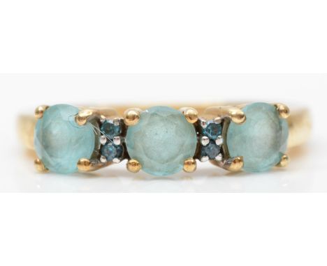 A 9ct gold and three blue gemstone ring, J 1/2, 2.1gm 