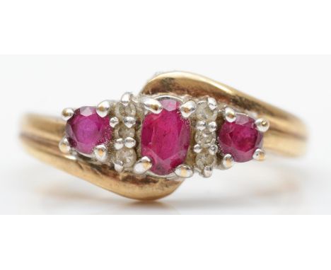 A 9ct gold ruby and diamond dress ring, L, 3.1gm 