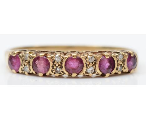 A 9ct gold five stone ruby ring, diamond points between, N, 1.4gm 