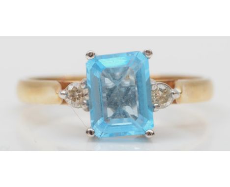 A 9ct gold blue stone and diamond three stone ring, P, 2.6gm 