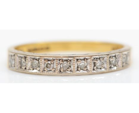 An 18ct gold nine stone diamond ring, P, 3.2gm 