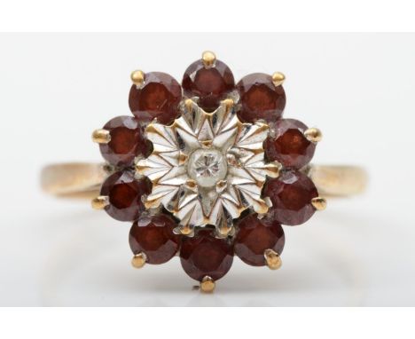 A 9ct gold ruby and diamond cluster ring, N 1/2, 2.6gm 