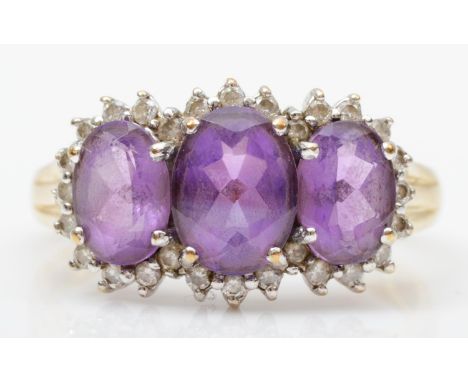 A 9ct gold amethyst and diamond triple cluster ring, Q, 2.9gm 