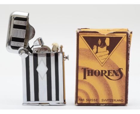 Thorens, an Art Deco semi automatic chrome and black enamel petrol lighter, model 2603, apparently unused and boxed. 
