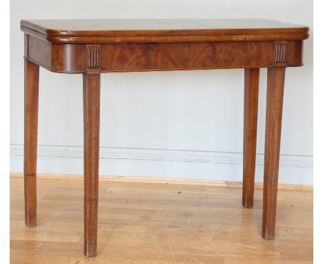 A late 19th century mahogany swivel top table, twisted to reveal internal storage, on tapered legs (two legs show signs of re