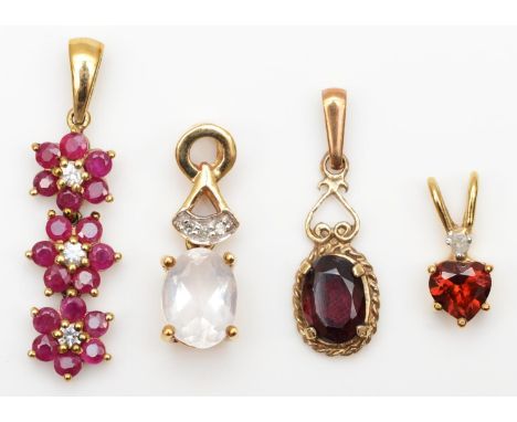 A 9ct gold ruby and diamond pendant, two garnet pendants and a rose quartz pendant, 3.6gm 